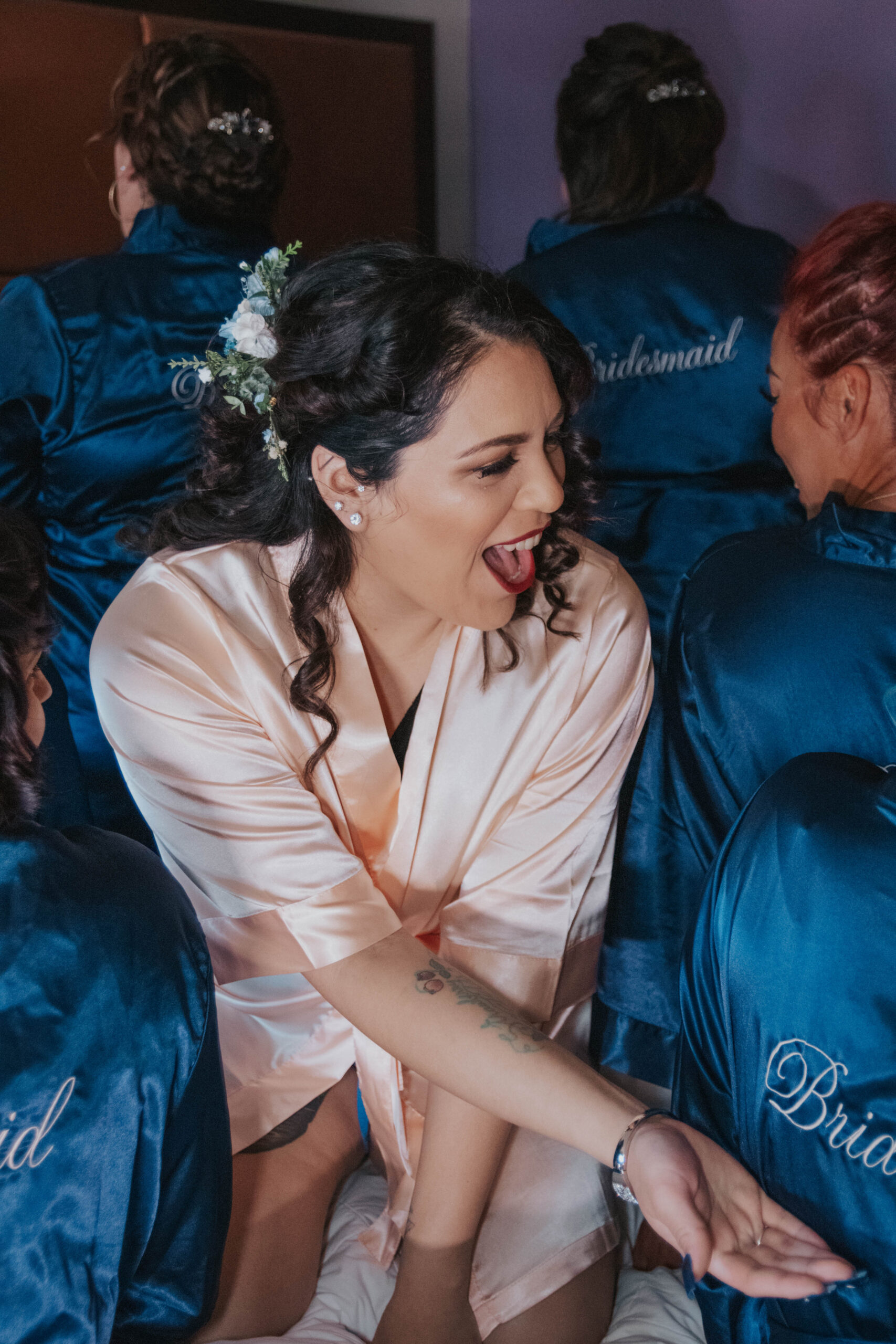 Bride points out her bridesmaids in a group photo.